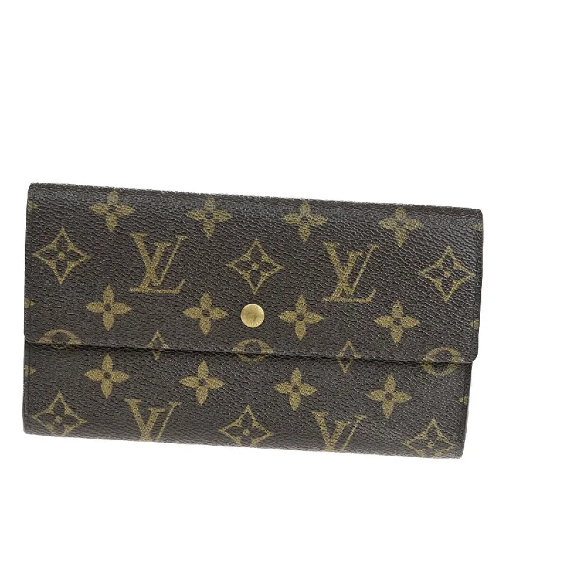 Keychains with playful hooks-Louis Vuitton Porte Tresor International  Canvas Wallet  (Pre-Owned)